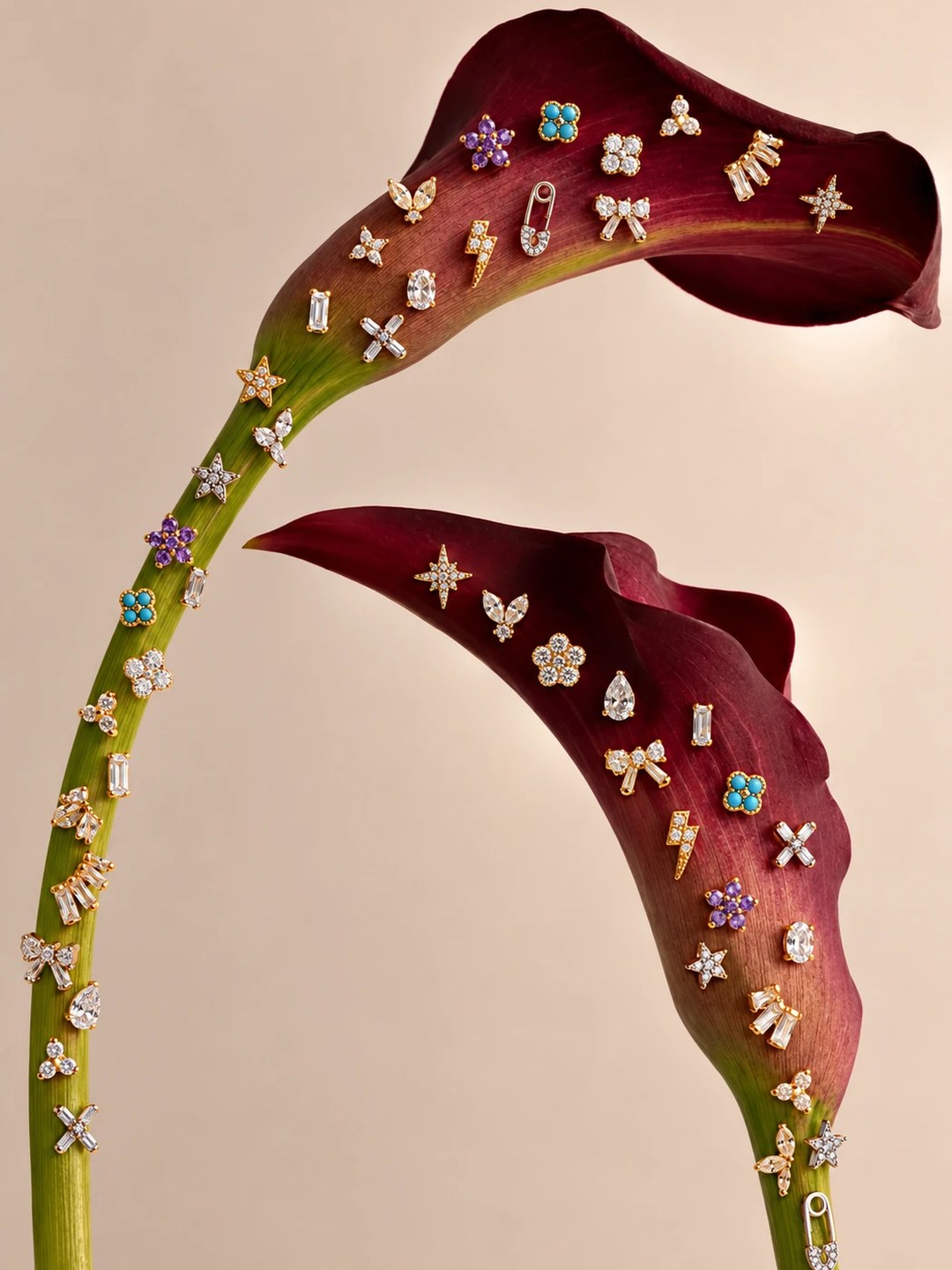 Stud earrings arranged on calla lilies